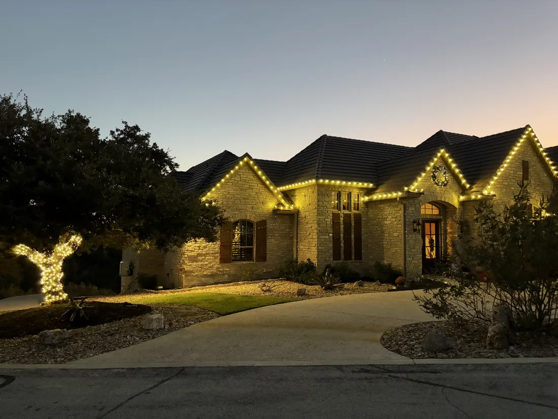 Full roofline traced in warm white at dusk